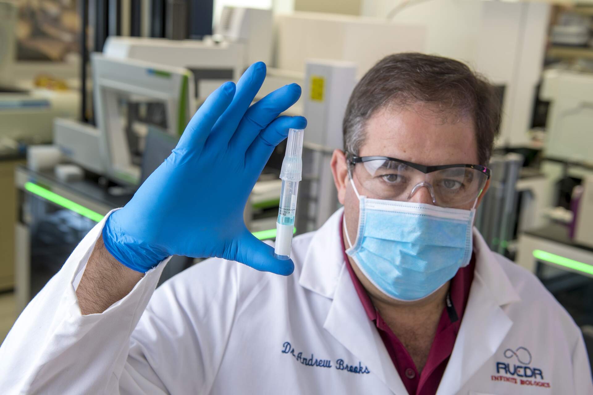 Dr. Andrew Brooks, Chief Operating Officer at RUCDR Infinite Biologics is processing Spectrum saliva collection devices